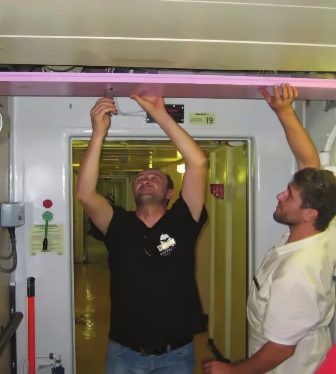 Installer fitting ceiling panels